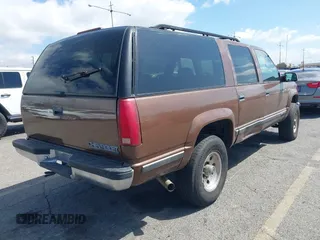 1999 Chevrolet Suburban with VIN 1GNGK26J9XJ494147, listed as a IAAI auction lot 41945149 with 102,652 mi miles. Bid and sale history available at carsss.com. Image 4.