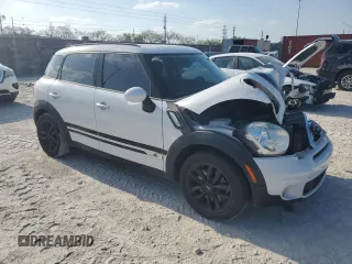 2012 MINI Countryman S with VIN WMWZC5C51CWL57074, listed as a Copart auction lot 53386715 with 55,857 mi miles and Salvage Title. Bid and sale history available at DreamBid. Image 4.