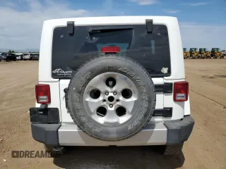 2014 Jeep Wrangler Unlimited Sahara with VIN 1C4BJWEG1EL210949, listed as a Copart auction lot 60977555 with 122,495 mi miles and Salvage title. Bid and sale history available at DreamBid. Image 6.