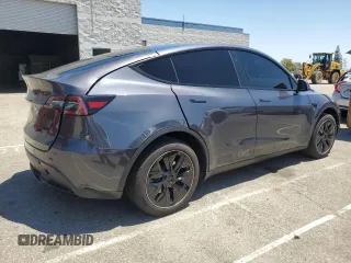 2024 Tesla Model Y Long Range with VIN 7SAYGDEEXRA215975, listed as a Copart auction lot 56705585 with 20,554 mi miles and Salvage Title. Bid and sale history available at DreamBid. Image 3.