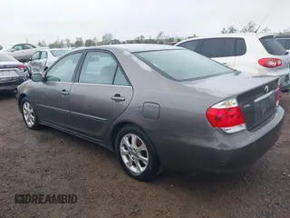 2005 Toyota Camry LE with VIN 4T1BF32K25U595176, listed as a IAAI auction lot 41932171 with 203,956 mi miles and . Bid and sale history available at DreamBid. Image 3.