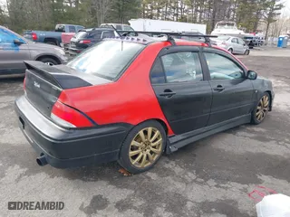 2003 Mitsubishi Lancer OZ-Rally with VIN JA3AJ86E03U078826, listed as a IAAI auction lot 41700333 with 119,656 mi miles. Bid and sale history available at carsss.com. Image 4.