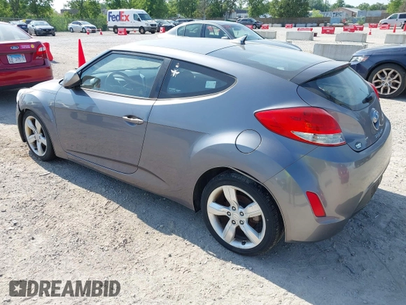 2013 Hyundai Veloster w/Gray Int with VIN KMHTC6AD9DU128725, listed as a IAAI auction lot 42648356 with 168,109 mi miles and . Bid and sale history available at DreamBid. Image 3.