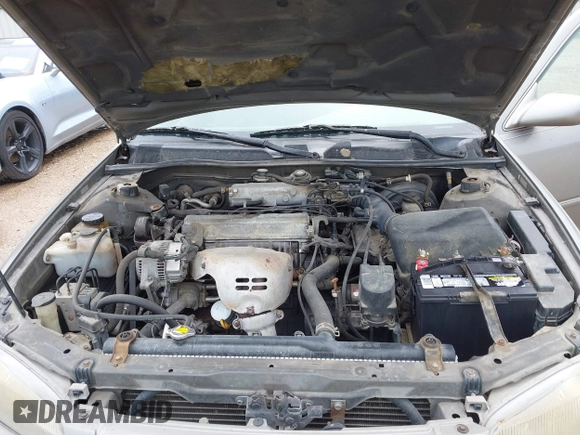1997 Toyota Camry LE z VIN 4T1BG22KXVU034196, wystawiony jako IAAI lot #42504214 z przebiegiem 155 915 mil mil oraz . Historia ofert i sprzedaży dostępna na DreamBid. Obrazek 10.