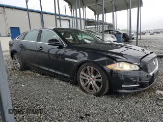 2014 Jaguar XJ Portfolio with VIN SAJWJ2GD5E8V69982, listed as a Copart auction lot 58933515 with 92,847 mi miles and Salvage title. Bid and sale history available at DreamBid. Image 4.