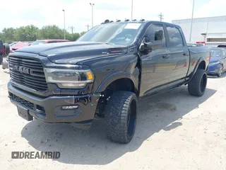 2021 Ram 2500 Laramie with VIN 3C6UR5FL7MG621346, listed as a IAAI auction lot 42419962 with 96,647 mi miles and . Bid and sale history available at DreamBid. Image 2.