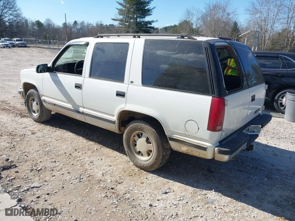 1996 Chevrolet Tahoe Limited with VIN 1GNEC13R0TJ309292, listed as a IAAI auction lot 41412643 with 219,815 mi miles. Bid and sale history available at carsss.com. Image 3.