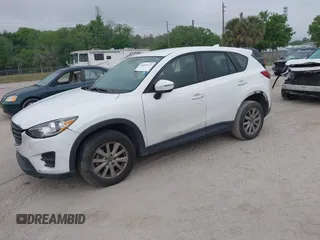 2016 Mazda CX-5 Sport with VIN JM3KE2BY1G0875484, listed as a IAAI auction lot 41838122 with 166,986 mi miles. Bid and sale history available at carsss.com. Image 21.