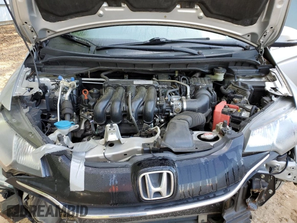 2015 Honda Fit EX-L z VIN 3HGGK5H82FM778601, wystawiony jako Copart lot #52494015 z przebiegiem 143 890 mil mil oraz Szkoda całkowita • Salvage title. Historia ofert i sprzedaży dostępna na DreamBid. Obrazek 12.
