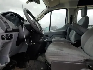 2016 Ford Transit Cargo with VIN 1FTYR1ZM8GKA89853, listed as a Copart auction lot 69234554 with 200,049 mi miles and Salvage Title. Bid and sale history available at DreamBid. Image 7.