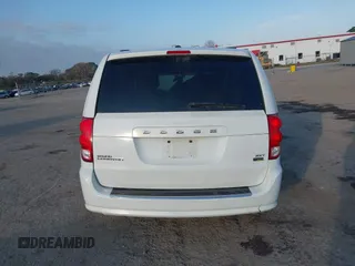 2016 Dodge Grand Caravan SXT with VIN 2C4RDGCGXGR257633, listed as a IAAI auction lot 41514684 with 108,743 mi miles and . Bid and sale history available at DreamBid. Image 16.
