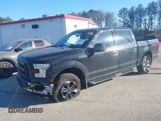 2015 Ford F-150 XLT with VIN 1FTEW1E86FFC00959, listed as a IAAI auction lot 41581711 with 130,298 mi miles. Bid and sale history available at carsss.com. Image 6.