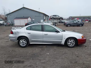 2003 Pontiac Grand Am SE with VIN 1G2NE52F03C323218, listed as a IAAI auction lot 41899309 with 90,195 mi miles. Bid and sale history available at carsss.com. Image 13.