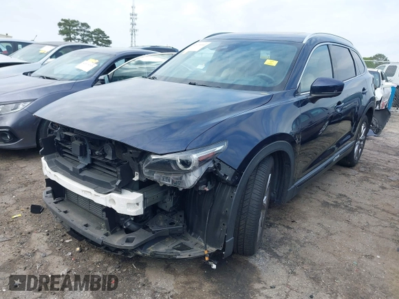 2021 Mazda CX-9 Carbon Edition with VIN JM3TCADY1M0516505, listed as a IAAI auction lot 42016644 with 50,900 mi miles and . Bid and sale history available at carsss.com. Image 2.