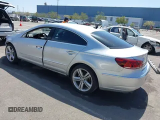 2014 Volkswagen CC R-Line with VIN WVWBP7AN0EE527649, listed as a IAAI auction lot 42009588 with 122,964 mi miles. Bid and sale history available at carsss.com. Image 3.