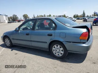 1998 Honda Civic DX with VIN JHMEJ6624WS000450, listed as a Copart auction lot 54217265 with 299,994 mi miles and Salvage Title. Bid and sale history available at carsss.com. Image 2.