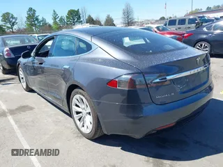 2017 Tesla Model S 100D with VIN 5YJSA1E20HF198503, listed as a IAAI auction lot 41843782 with 77,281 mi miles and . Bid and sale history available at DreamBid. Image 3.