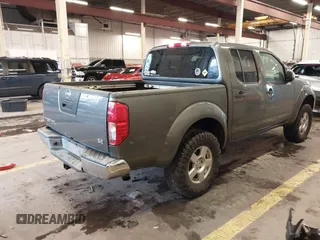 2005 Nissan Frontier 4WD LE with VIN 1N6AD07W95C411421, listed as a IAAI auction lot 41847242 with 209,816 mi miles. Bid and sale history available at carsss.com. Image 4.