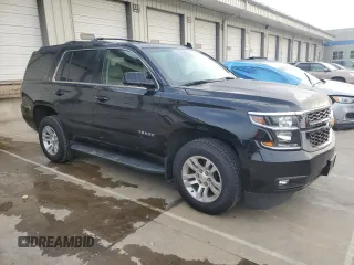 2019 Chevrolet Tahoe LT with VIN 1GNSKBKC2KR349527, listed as a Copart auction lot 58496695 with 128,590 mi miles and Salvage title. Bid and sale history available at DreamBid. Image 4.