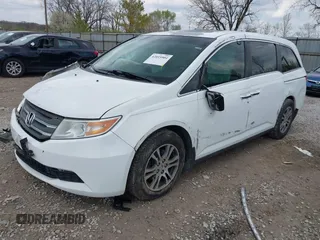 2012 Honda Odyssey EX-L with VIN 5FNRL5H67CB082903, listed as a IAAI auction lot 42015904 with 208,300 mi miles and . Bid and sale history available at carsss.com. Image 2.