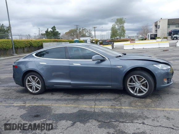 2013 Tesla Model S with VIN 5YJSA1CN8DFP21869, listed as a IAAI auction lot 41772603 with Not provided miles and . Bid and sale history available at DreamBid. Image 12.