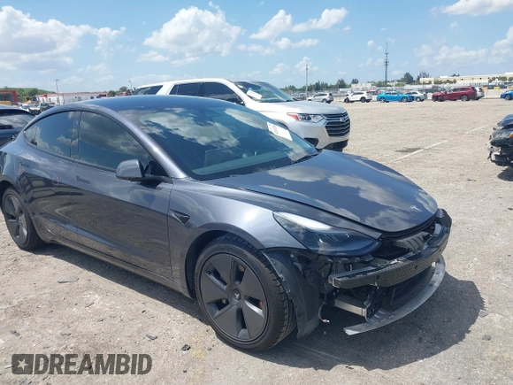 2023 Tesla Model 3 with VIN 5YJ3E1EAXPF575448, listed as a IAAI auction lot 42019288 with 33,859 mi miles and . Bid and sale history available at carsss.com. Image 1.