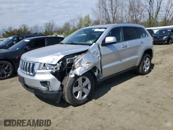 2012 Jeep Grand Cherokee Laredo with VIN 1C4RJFAG4CC123354, listed as a Copart auction lot 52711295 with 151,004 mi miles and Salvage Title. Bid and sale history available at carsss.com. Image 1.