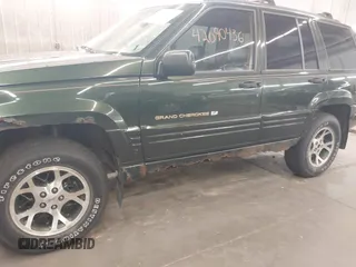 1997 Jeep Grand Cherokee Limited with VIN 1J4GZ78Y0VC684023, listed as a IAAI auction lot 42090436 with 310,831 mi miles. Bid and sale history available at carsss.com. Image 6.