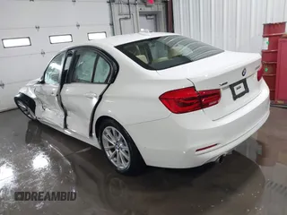 2018 BMW 3 Series 320i xDrive with VIN WBA8E5G56JNU47338, listed as a IAAI auction lot 41238204 with 54,596 mi miles. Bid and sale history available at carsss.com. Image 3.