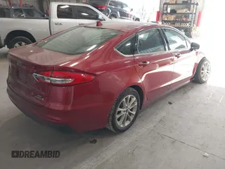 2019 Ford Fusion Hybrid SE with VIN 3FA6P0LUXKR205712, listed as a IAAI auction lot 41267049 with 124,687 mi miles. Bid and sale history available at carsss.com. Image 4.
