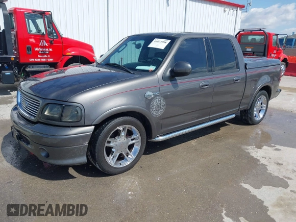 2002 Ford F-150 Harley Davidson with VIN 1FTRW07392KE11409, listed as a IAAI auction lot 41877998 with 148,476 mi miles. Bid and sale history available at carsss.com. Image 17.