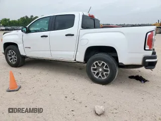 2022 GMC Canyon 4WD AT4 z VIN 1GTG6FEN2N1210072, wystawiony jako Copart lot #57084565 z przebiegiem 64 897 mil mil oraz Szkoda całkowita • Salvage title. Historia ofert i sprzedaży dostępna na DreamBid. Obrazek 2.