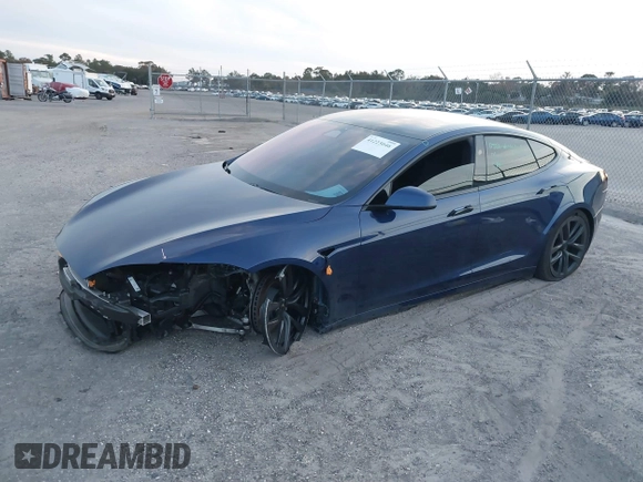 2023 Tesla Model S with VIN 5YJSA1E53PF518986, listed as a IAAI auction lot 41223046 with 22,204 mi miles and . Bid and sale history available at DreamBid. Image 2.
