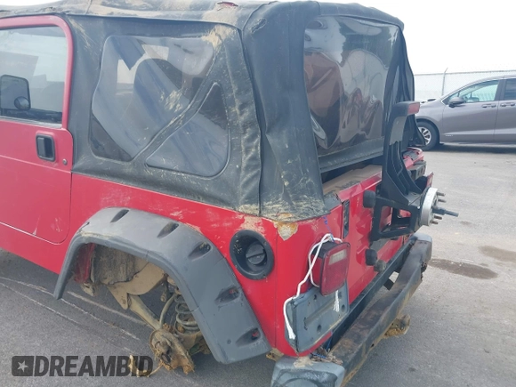 2001 Jeep Wrangler Sport z VIN 1J4FA49S31P335680, wystawiony jako IAAI lot #42471312 z przebiegiem 212 927 mil mil oraz . Historia ofert i sprzedaży dostępna na DreamBid. Obrazek 6.