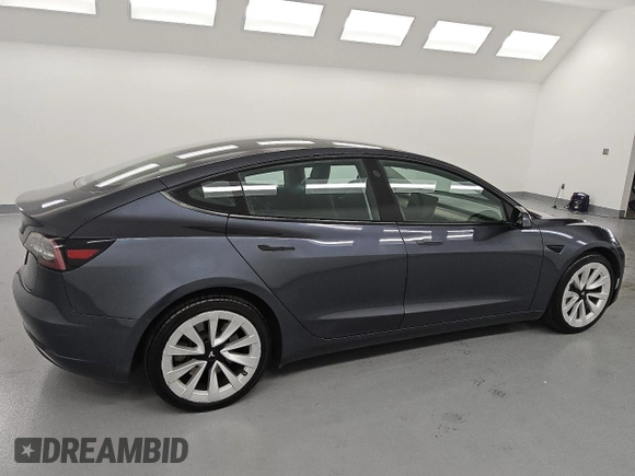 2023 Tesla Model 3 z VIN 5YJ3E1EA3PF459640, wystawiony jako Copart lot #61107195 z przebiegiem 141 027 mil mil oraz Czysty tytuł • Clean title. Historia ofert i sprzedaży dostępna na DreamBid. Obrazek 3.