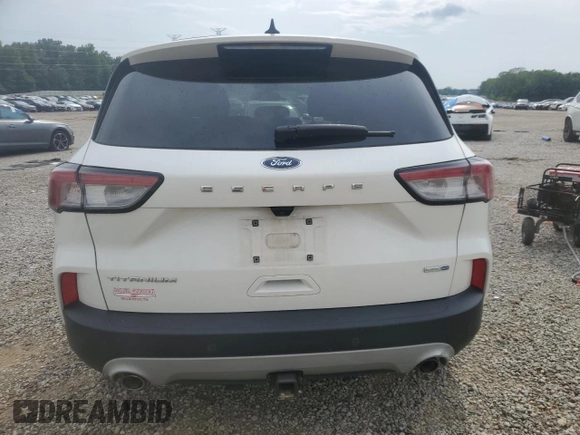 2020 Ford Escape Titanium z VIN 1FMCU9J9XLUB57675, wystawiony jako Copart lot #57777795 z przebiegiem Nie podano mil oraz Szkoda całkowita • Salvage title. Historia ofert i sprzedaży dostępna na DreamBid. Obrazek 6.