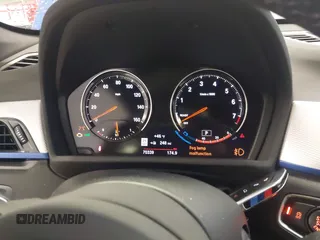 2019 BMW X1 xDrive28i with VIN WBXHT3C53K5L36690, listed as a IAAI auction lot 42012992 with 70,339 mi miles. Bid and sale history available at carsss.com. Image 7.