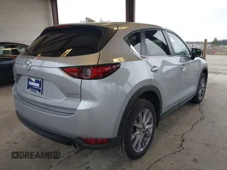 2020 Mazda CX-5 Grand Touring with VIN JM3KFADM0L0738693, listed as a IAAI auction lot 41725906 with 63,629 mi miles. Bid and sale history available at carsss.com. Image 4.