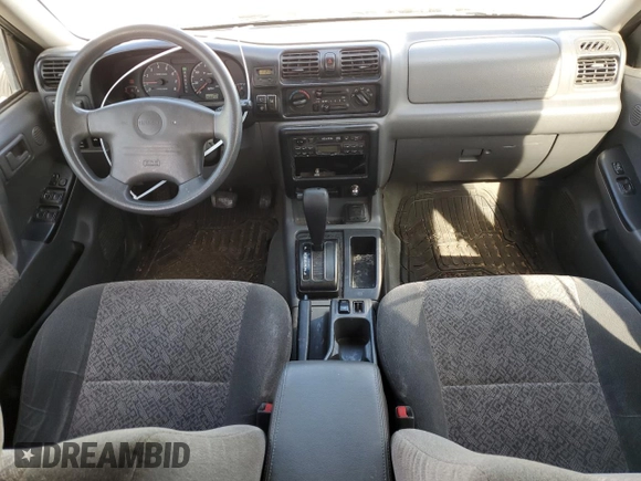 2000 Isuzu Rodeo S z VIN 4S2CK58W2Y4317915, wystawiony jako Copart lot #81780094 z przebiegiem 158 217 mil mil oraz Szkoda całkowita • Salvage title. Historia ofert i sprzedaży dostępna na DreamBid. Obrazek 8.