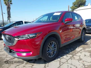 2019 Mazda CX-5 Sport with VIN JM3KFABM0K1633065, listed as a IAAI auction lot 41968786 with 90,407 mi miles and . Bid and sale history available at DreamBid. Image 2.