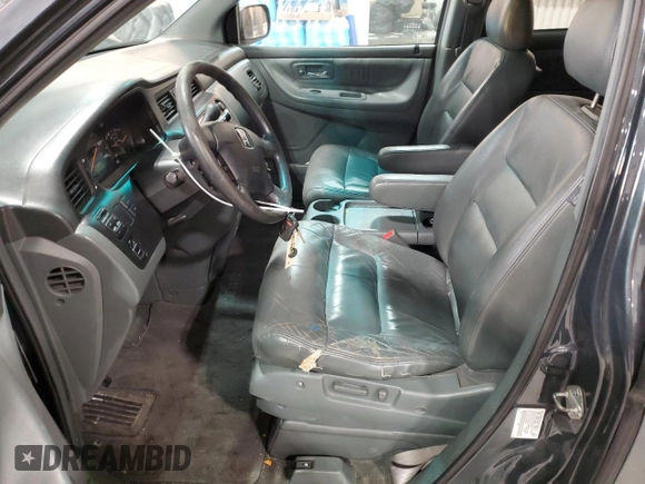 2003 Honda Odyssey EX-L z VIN 5FNRL18943B020961, wystawiony jako Copart lot #86009874 z przebiegiem 155 993 mil mil oraz Szkoda całkowita • Salvage title. Historia ofert i sprzedaży dostępna na DreamBid. Obrazek 7.