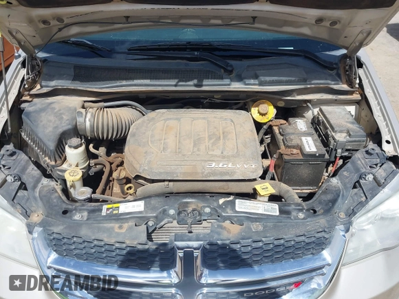 2014 Dodge Grand Caravan SXT with VIN 2C4RDGCG6ER466459, listed as a IAAI auction lot 41820907 with 105,404 mi miles and . Bid and sale history available at DreamBid. Image 10.