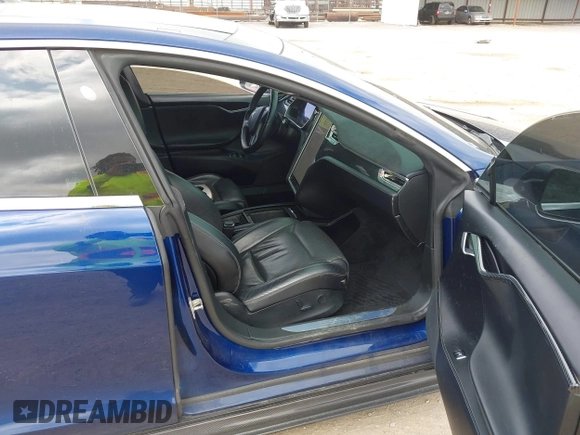 2016 Tesla Model S 90D with VIN 5YJSA1E4XGF168165, listed as a IAAI auction lot 42220139 with Not provided miles and . Bid and sale history available at DreamBid. Image 5.