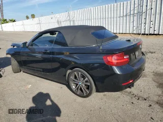 2015 BMW 2 Series 228i with VIN WBA1K5C59FV242992, listed as a Copart auction lot 75433654 with Not provided miles and Salvage title. Bid and sale history available at DreamBid. Image 2.