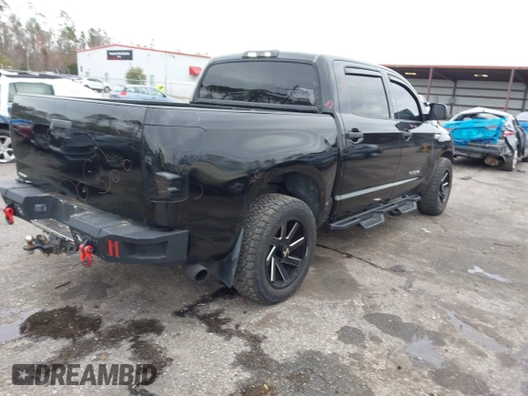 2012 Toyota Tundra 4WD Truck with VIN 5TFDW5F14CX268378, listed as a IAAI auction lot 41412922 with 148,763 mi miles. Bid and sale history available at carsss.com. Image 4.