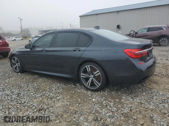 2019 BMW 7 Series 750i with VIN WBA7F0C54KGM25281, listed as a Copart auction lot 84741334 with 76,472 mi miles and Salvage Title. Bid and sale history available at carsss.com. Image 2.