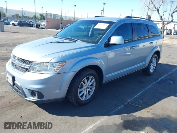 2013 Dodge Journey SXT with VIN 3C4PDCBG5DT674863, listed as a IAAI auction lot 41670225 with 207,524 mi miles. Bid and sale history available at carsss.com. Image 2.
