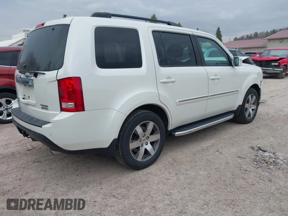 2014 Honda Pilot Touring with VIN 5FNYF4H91EB041614, listed as a IAAI auction lot 42050405 with 158,236 mi miles and . Bid and sale history available at DreamBid. Image 4.