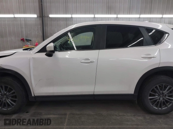 2017 Mazda CX-5 Touring with VIN JM3KFBCL9H0107589, listed as a IAAI auction lot 41241481 with 77,032 mi miles. Bid and sale history available at carsss.com. Image 14.
