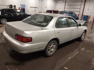 1995 Toyota Camry LE with VIN 4T1GK12E5SU080734, listed as a IAAI auction lot 41738102 with 211,559 mi miles. Bid and sale history available at carsss.com. Image 4.